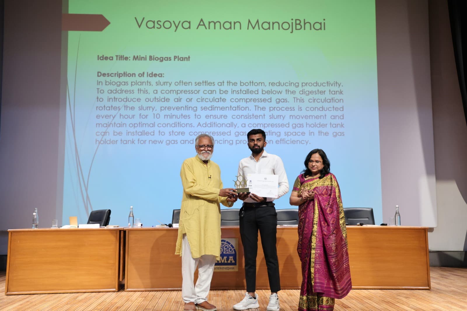 Vasoya Aman ManojBhai receiving award for Mini Biogas Plant innovation